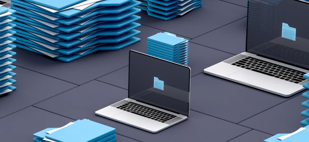 Stacked blue computer files and folders along with open laptops on a gray square floor